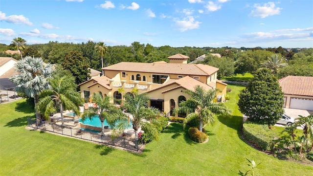 12812 Jacob Grace Ct, Windermere, FL 34786 - rear view of house featuring a tiled roof, stucco siding, and a patio