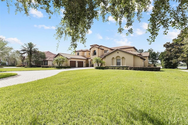 12812 Jacob Grace Ct, Windermere, FL 34786 - mediterranean / spanish house featuring driveway, stucco siding, a tiled roof, and a front yard