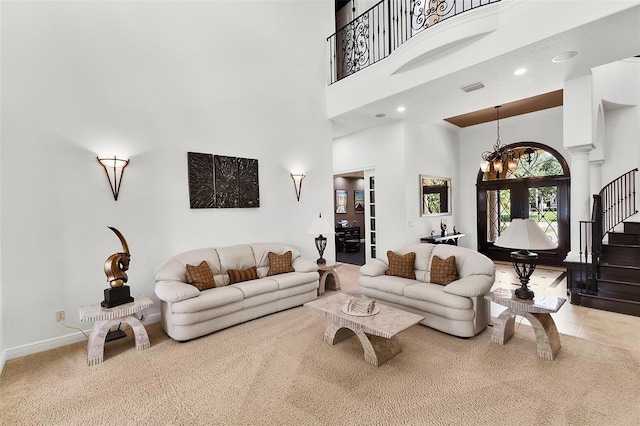 12812 Jacob Grace Ct, Windermere, FL 34786 - carpeted living room with a high ceiling, stairs, and a chandelier
