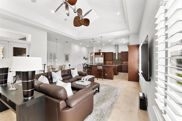 12812 Jacob Grace Ct, Windermere, FL 34786 - living area featuring ceiling fan, a raised ceiling, and a high ceiling