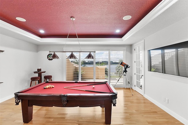 12812 Jacob Grace Ct, Windermere, FL 34786 - game room featuring a raised ceiling, light wood-style floors, billiards, a textured ceiling, and recessed lighting