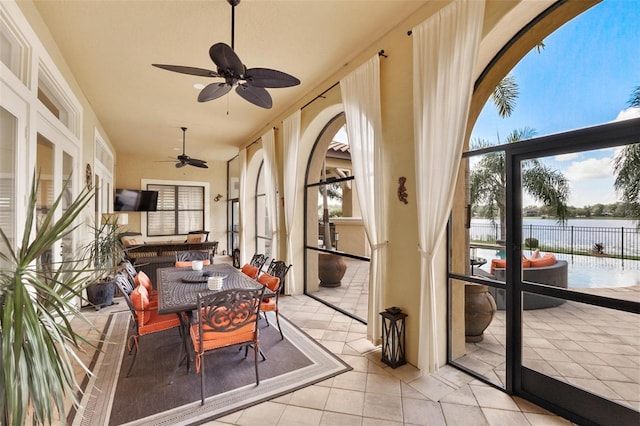 12812 Jacob Grace Ct, Windermere, FL 34786 - sunroom with a water view, healthy amount of natural light, tile patterned flooring, and french doors
