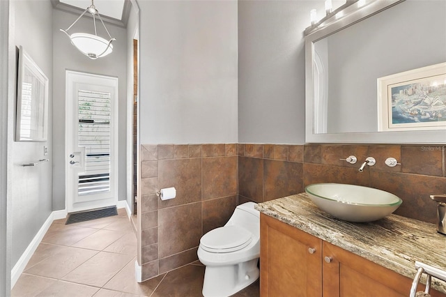 12812 Jacob Grace Ct, Windermere, FL 34786 - bathroom featuring tile walls, tile patterned floors, and vanity