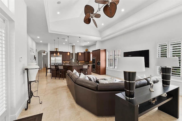 12812 Jacob Grace Ct, Windermere, FL 34786 - living area featuring ceiling fan, light tile patterned flooring, recessed lighting, a raised ceiling, and arched walkways