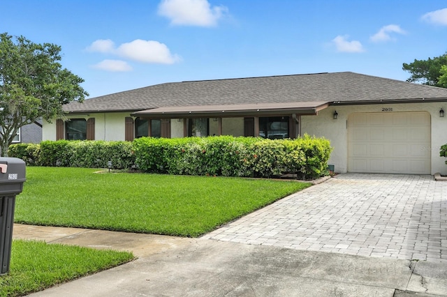 2931 Lantern Dr, South Daytona, FL 32119 - single story home with a garage, decorative driveway, stucco siding, and roof with shingles
