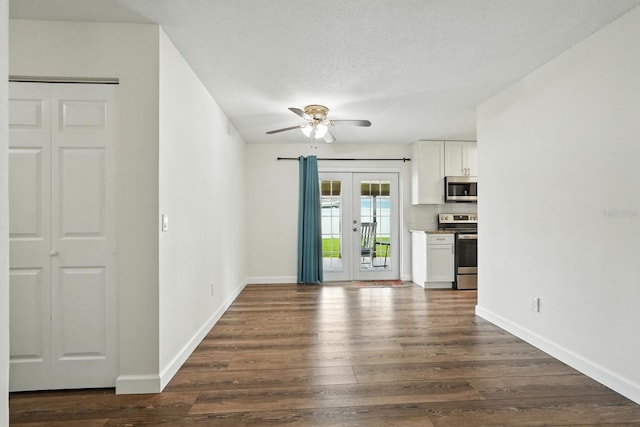 2931 Lantern Dr, South Daytona, FL 32119 - unfurnished living room with ceiling fan, dark wood-style floors, french doors, and a textured ceiling