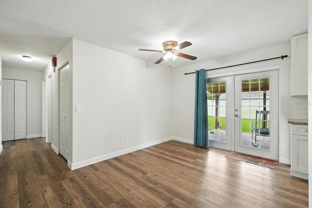2931 Lantern Dr, South Daytona, FL 32119 - spare room with ceiling fan, hardwood / wood-style flooring, french doors, and a textured ceiling