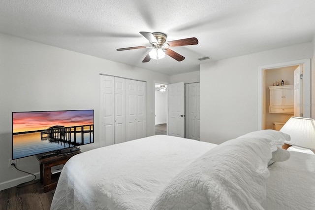 2931 Lantern Dr, South Daytona, FL 32119 - bedroom featuring wood finished floors, two closets, a ceiling fan, access to outside, and ensuite bathroom