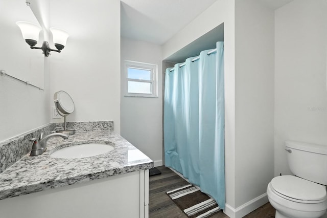 2931 Lantern Dr, South Daytona, FL 32119 - bathroom with vanity, wood finished floors, and curtained shower
