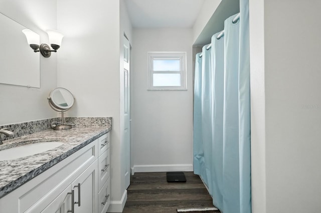 2931 Lantern Dr, South Daytona, FL 32119 - full bathroom with vanity and wood finished floors