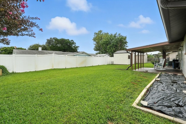 2931 Lantern Dr, South Daytona, FL 32119 - fenced backyard featuring a patio and an outdoor structure