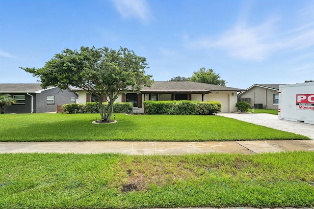 2931 Lantern Dr, South Daytona, FL 32119 - view of front of house with an attached garage, driveway, and a front lawn