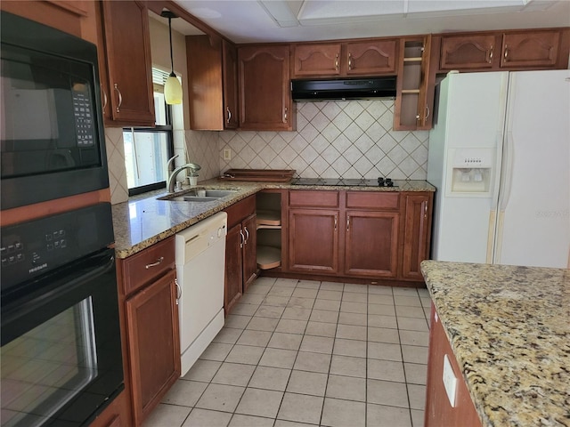 5915 Crystal View Dr, Orlando, FL 32819 - kitchen featuring black appliances, under cabinet range hood, backsplash, light tile patterned floors, and light stone counters