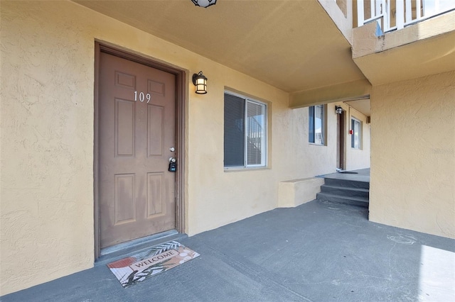 415 N Halifax Ave Unit 109, Daytona Beach, FL 32118 - doorway to property featuring stucco siding