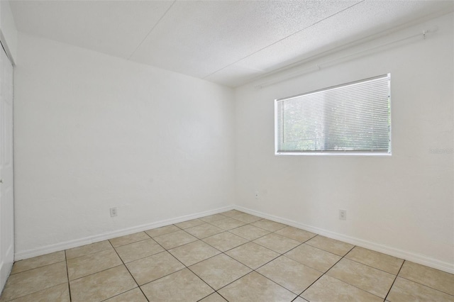 415 N Halifax Ave Unit 109, Daytona Beach, FL 32118 - unfurnished room featuring light tile patterned floors and baseboards