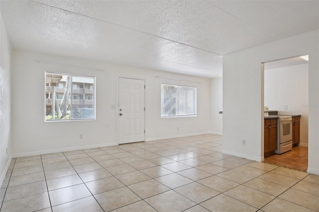 415 N Halifax Ave Unit 109, Daytona Beach, FL 32118 - entrance foyer featuring a textured ceiling and light tile patterned floors