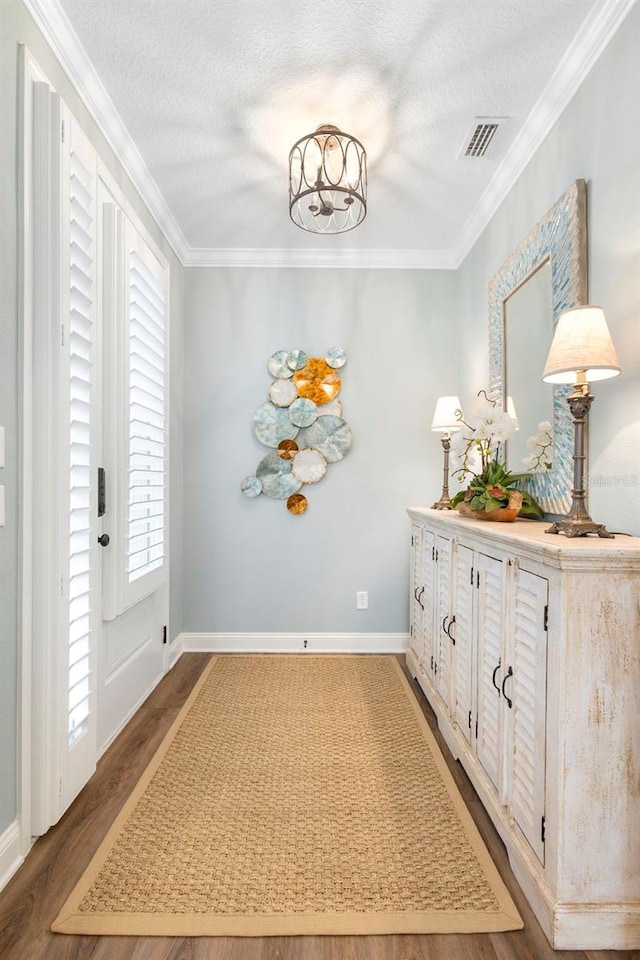 249 Kellet Way, Saint Johns, FL 32259 - hall with healthy amount of natural light, wood finished floors, crown molding, and a textured ceiling