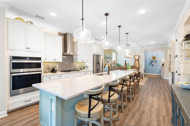 249 Kellet Way, Saint Johns, FL 32259 - kitchen with a large island, light wood-style floors, recessed lighting, white cabinets, and backsplash