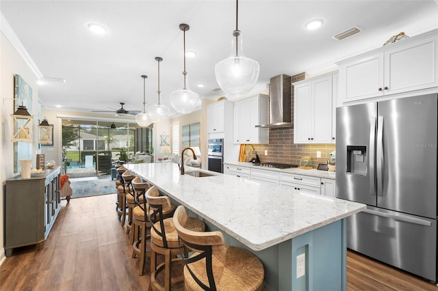 249 Kellet Way, Saint Johns, FL 32259 - kitchen with stainless steel appliances, ornamental molding, dark wood-style floors, a ceiling fan, and white cabinets