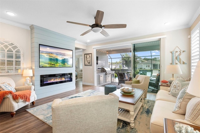 249 Kellet Way, Saint Johns, FL 32259 - living room featuring a glass covered fireplace, wood finished floors, ornamental molding, a ceiling fan, and recessed lighting