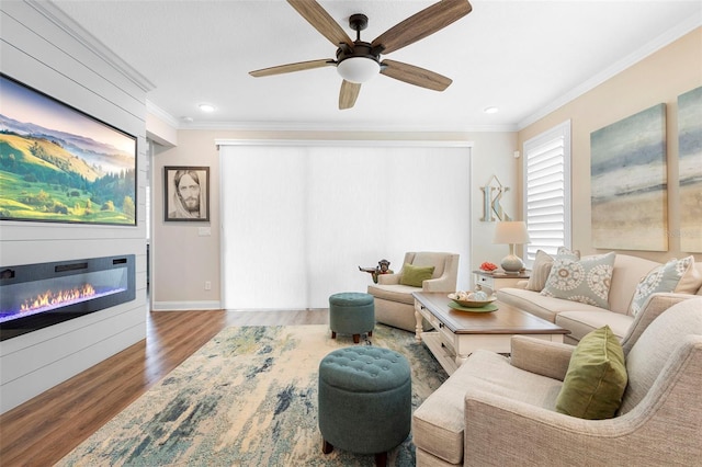 249 Kellet Way, Saint Johns, FL 32259 - living area featuring wood finished floors, crown molding, a glass covered fireplace, ceiling fan, and recessed lighting
