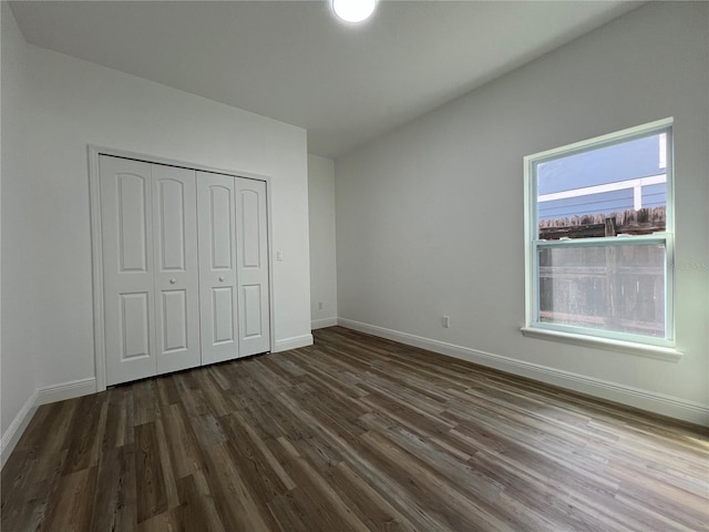 1510 Granada Ave, Daytona Beach, FL 32117 - unfurnished bedroom featuring dark wood-style flooring and a closet