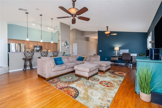 6151 Sabal Point Cir, Port Orange, FL 32128 - living room featuring a ceiling fan, an office area, light wood-style flooring, and high vaulted ceiling