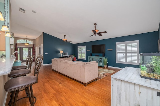 6151 Sabal Point Cir, Port Orange, FL 32128 - living room featuring light wood-style flooring, lofted ceiling, and ceiling fan