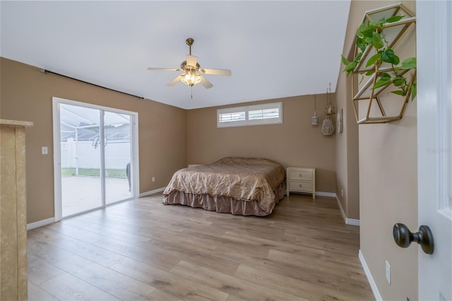 6151 Sabal Point Cir, Port Orange, FL 32128 - bedroom with access to exterior, light wood finished floors, and ceiling fan