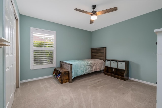 6151 Sabal Point Cir, Port Orange, FL 32128 - carpeted bedroom with baseboards and a ceiling fan