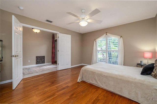 6151 Sabal Point Cir, Port Orange, FL 32128 - bedroom featuring wood finished floors and ceiling fan