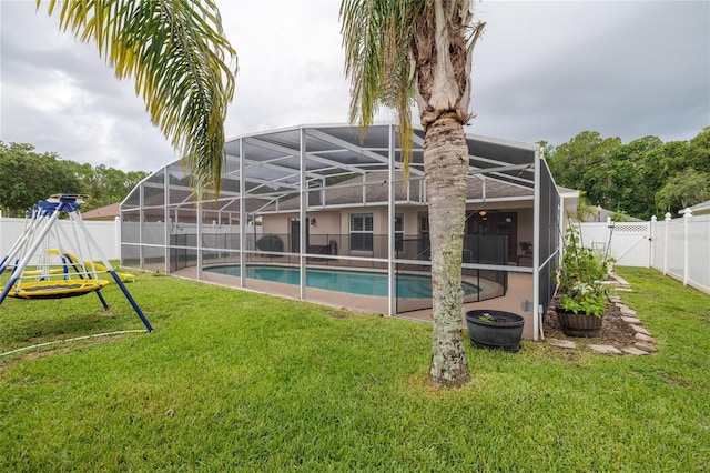 6151 Sabal Point Cir, Port Orange, FL 32128 - back of house with a fenced backyard and glass enclosure