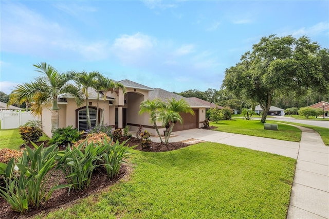 6151 Sabal Point Cir, Port Orange, FL 32128 - mediterranean / spanish house with stucco siding, driveway, and a garage