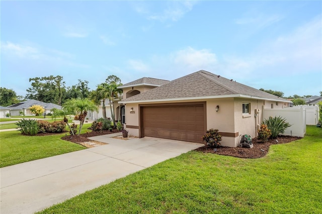 6151 Sabal Point Cir, Port Orange, FL 32128 - ranch-style home with a shingled roof, stucco siding, an attached garage, and driveway