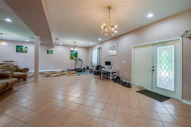4666 Fir Rd, New Smyrna Beach, FL 32168 - entryway featuring light tile patterned floors, a chandelier, and recessed lighting