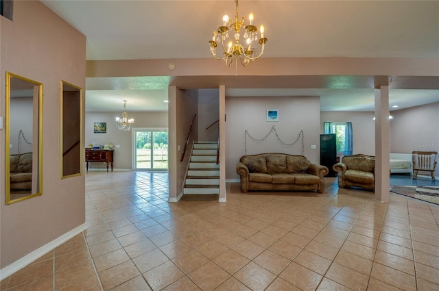 4666 Fir Rd, New Smyrna Beach, FL 32168 - living room featuring a chandelier, light tile patterned flooring, plenty of natural light, and stairs