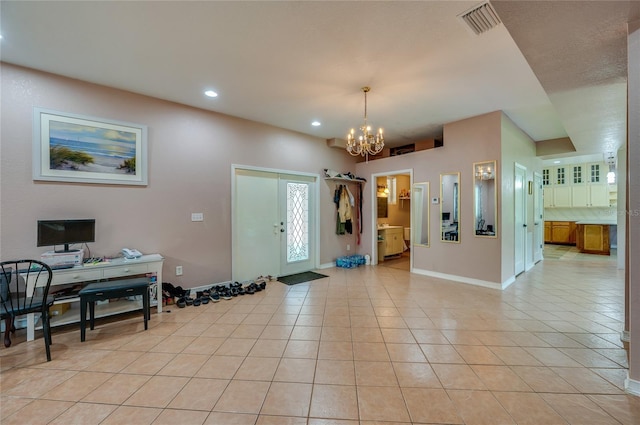 4666 Fir Rd, New Smyrna Beach, FL 32168 - entrance foyer featuring a chandelier, light tile patterned flooring, and recessed lighting