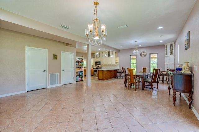 4666 Fir Rd, New Smyrna Beach, FL 32168 - dining room featuring a chandelier, recessed lighting, and light tile patterned floors