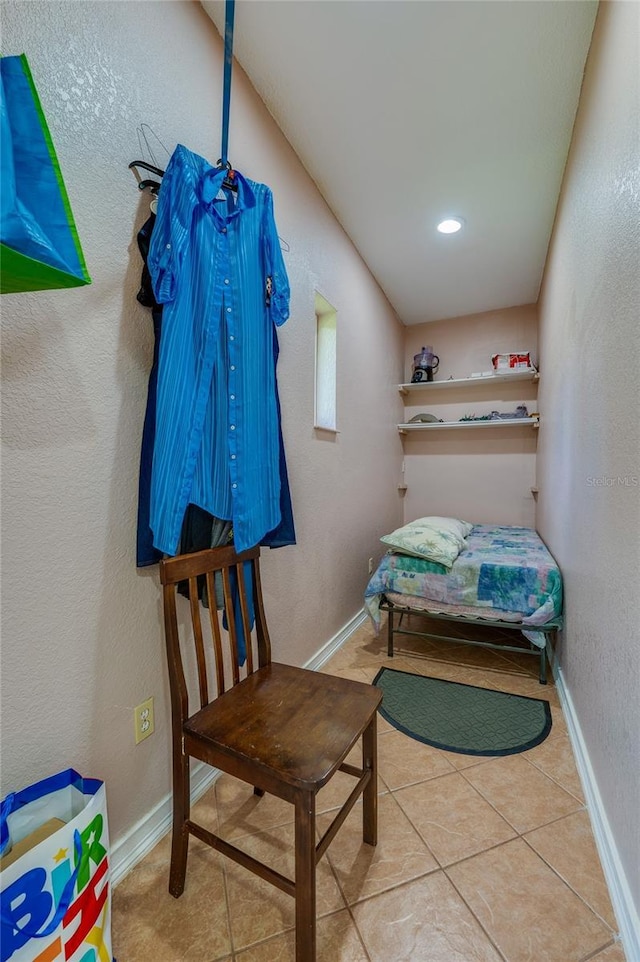 4666 Fir Rd, New Smyrna Beach, FL 32168 - tiled bedroom featuring baseboards