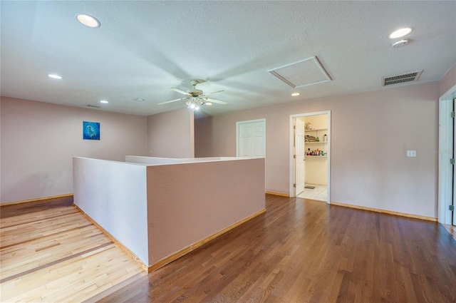 4666 Fir Rd, New Smyrna Beach, FL 32168 - spare room with ceiling fan, wood finished floors, a smoke detector, recessed lighting, and attic access