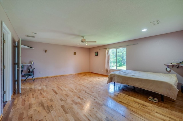 4666 Fir Rd, New Smyrna Beach, FL 32168 - bedroom with light wood-style floors, ceiling fan, and recessed lighting