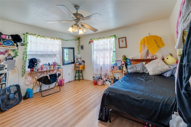 4666 Fir Rd, New Smyrna Beach, FL 32168 - bedroom featuring wood finished floors, a textured ceiling, and ceiling fan