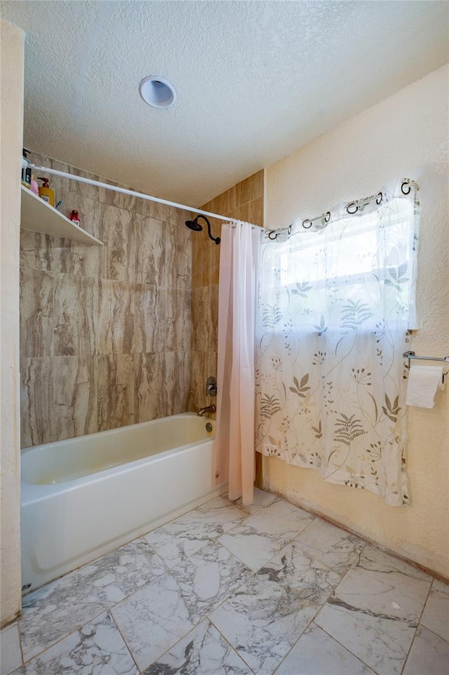 4666 Fir Rd, New Smyrna Beach, FL 32168 - full bathroom with shower / bath combo with shower curtain, a textured ceiling, and marble look tile flooring