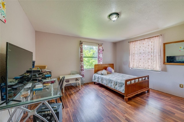 4666 Fir Rd, New Smyrna Beach, FL 32168 - bedroom with wood finished floors and a textured ceiling