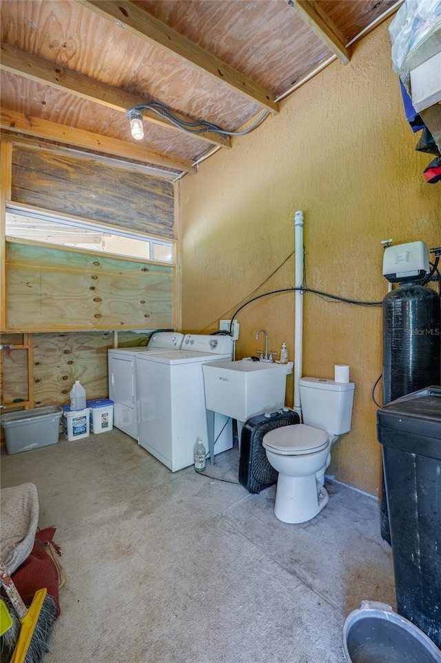 4666 Fir Rd, New Smyrna Beach, FL 32168 - bathroom with separate washer and dryer and toilet