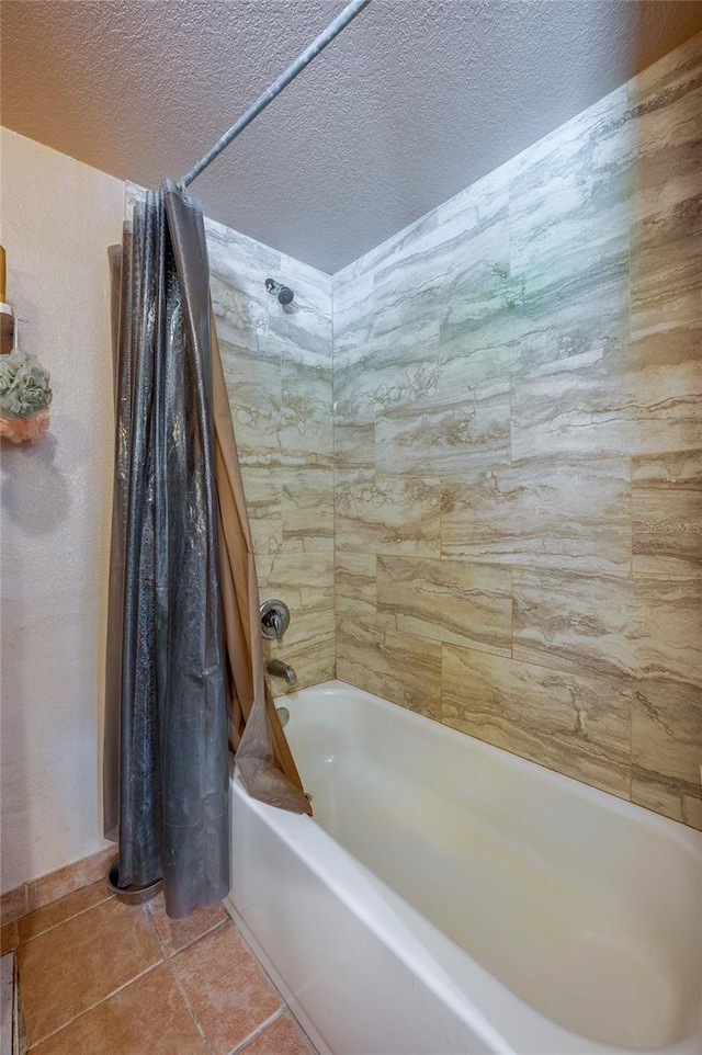 4666 Fir Rd, New Smyrna Beach, FL 32168 - bathroom with shower / tub combo, a textured ceiling, and tile patterned flooring