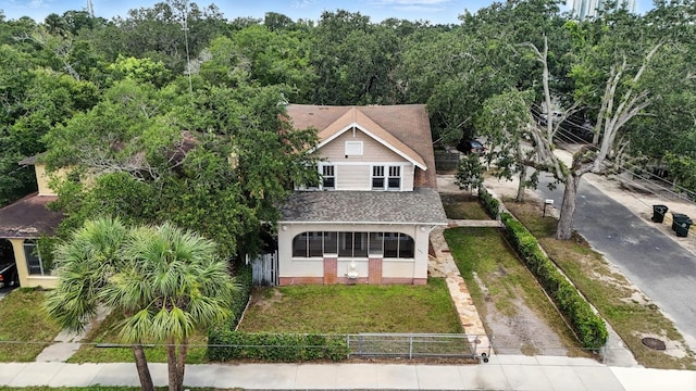 200 N St, Daytona Beach, FL 32114 - view of front of home featuring a fenced front yard and a shingled roof