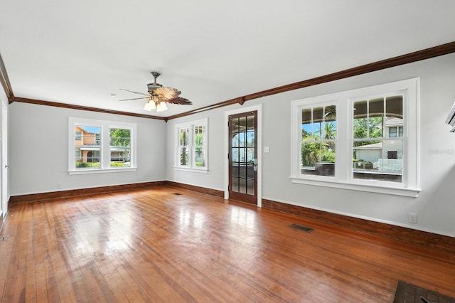 200 N St, Daytona Beach, FL 32114 - spare room featuring crown molding, wood-type flooring, and ceiling fan