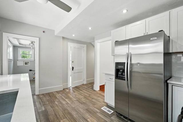 200 N St, Daytona Beach, FL 32114 - kitchen with stainless steel fridge with ice dispenser, ceiling fan, wood finished floors, light countertops, and recessed lighting