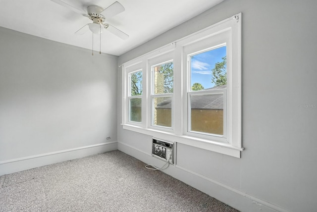 200 N St, Daytona Beach, FL 32114 - unfurnished room with an AC wall unit, carpet floors, and ceiling fan